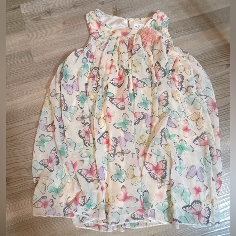 Butterfly sleeveless dress with flower accent